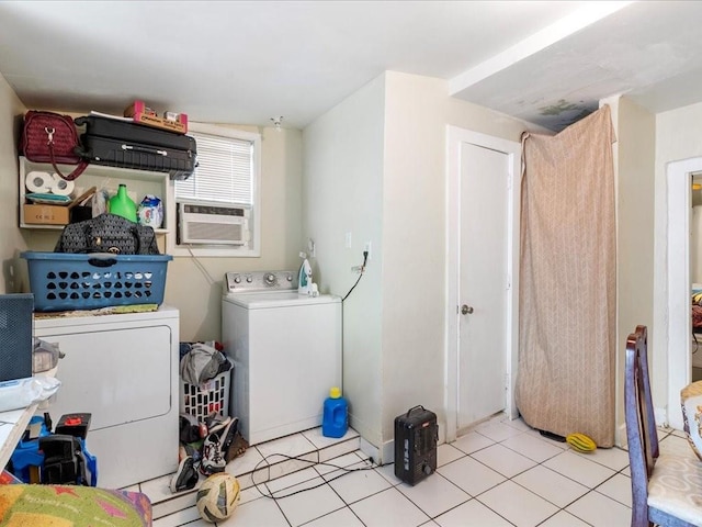 clothes washing area with washer and dryer, laundry area, cooling unit, and light tile patterned floors