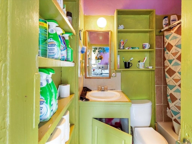 full bathroom with vanity and toilet