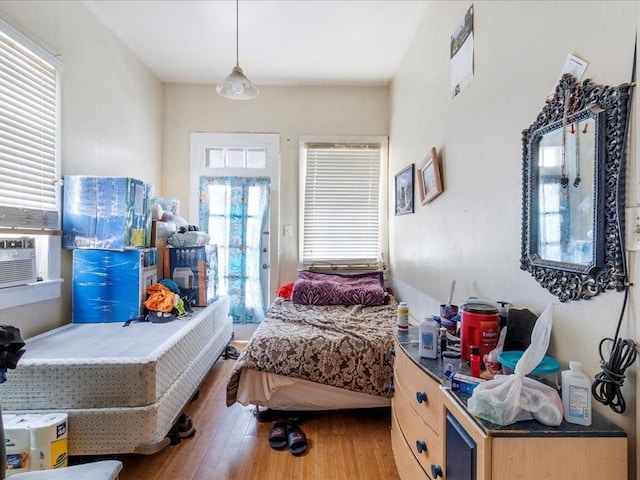 bedroom featuring wood finished floors