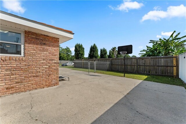 view of patio / terrace featuring fence