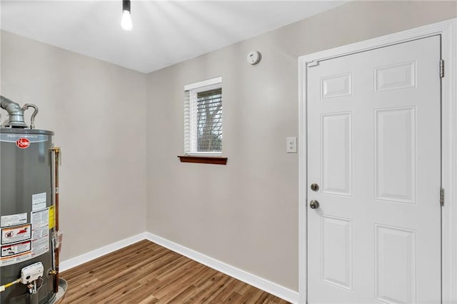 utility room featuring water heater