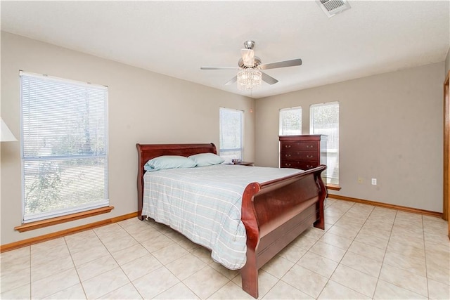 bedroom featuring visible vents, ceiling fan, baseboards, and light tile patterned flooring