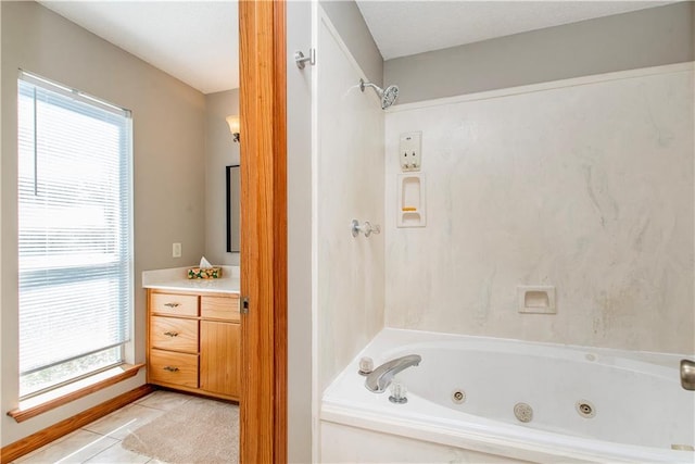 bathroom featuring tile patterned floors, a wealth of natural light, and vanity