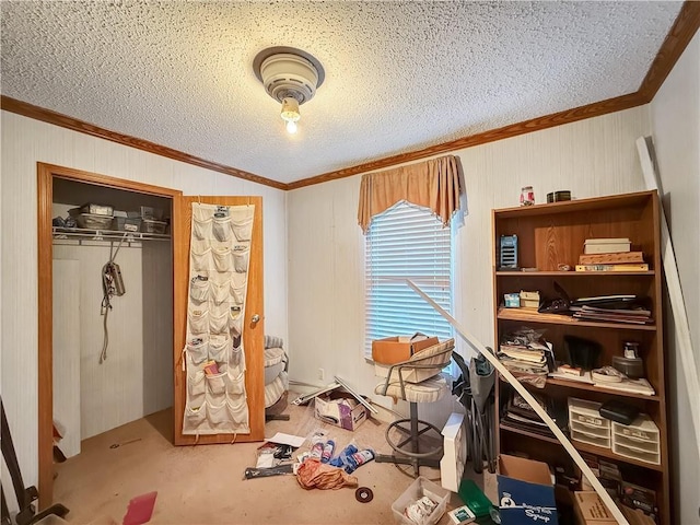 interior space with ornamental molding, a closet, and a textured ceiling