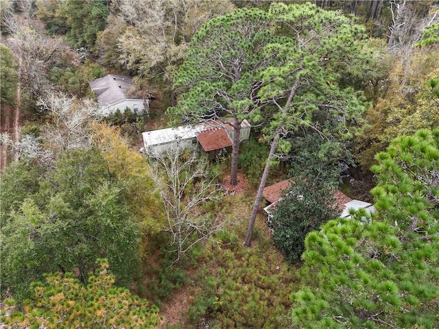 birds eye view of property featuring a wooded view