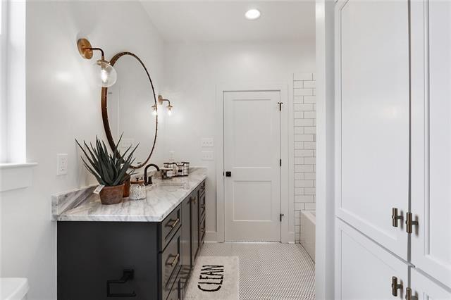 bathroom with recessed lighting, vanity, toilet, and tile patterned floors