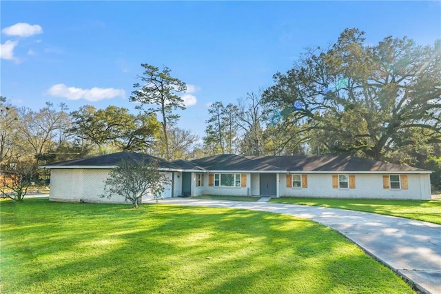 ranch-style house with a garage, driveway, a front lawn, and brick siding