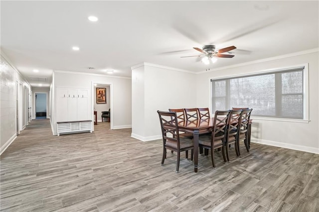 dining space featuring ornamental molding, recessed lighting, baseboards, and wood finished floors