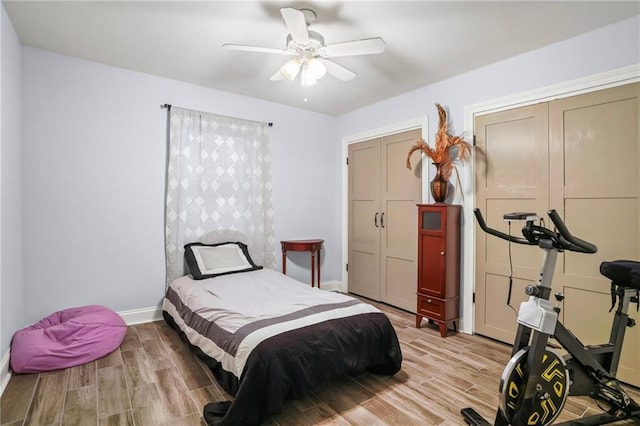 bedroom featuring ceiling fan, light wood finished floors, a closet, and baseboards