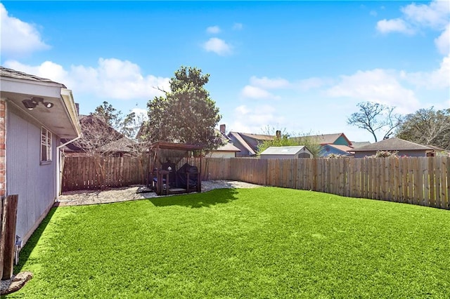 view of yard with a fenced backyard