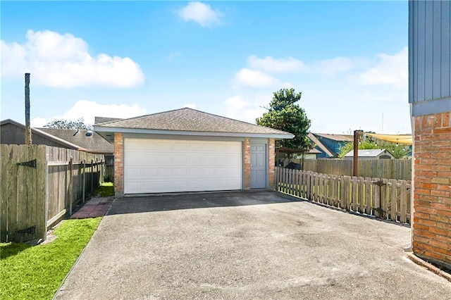 detached garage featuring fence