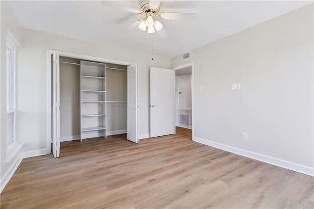 unfurnished bedroom with light wood-style floors, baseboards, and visible vents