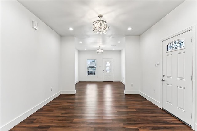 entryway with dark wood-style floors, baseboards, a chandelier, and recessed lighting