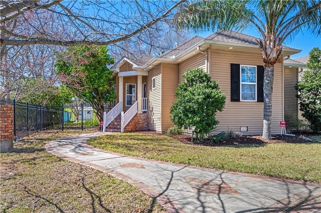 view of front of house with a front lawn and fence