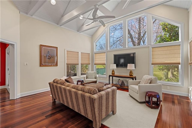 living area with baseboards, high vaulted ceiling, and dark wood-type flooring