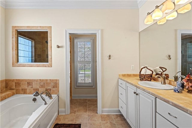 bathroom with tile patterned flooring, vanity, baseboards, ornamental molding, and a bath