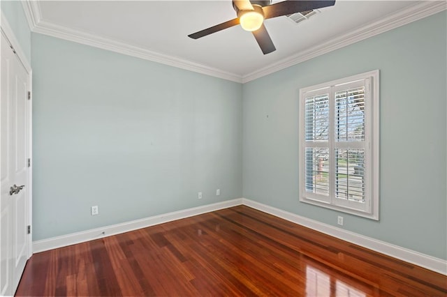 unfurnished room with dark wood-type flooring, ornamental molding, baseboards, and a ceiling fan