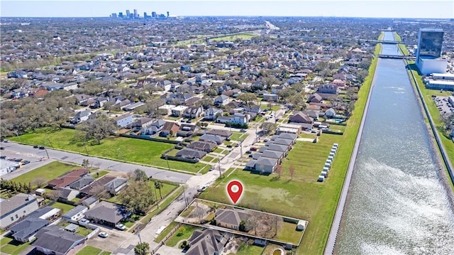 drone / aerial view featuring a water view and a residential view