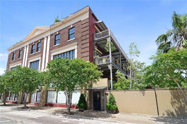 view of building exterior featuring fence