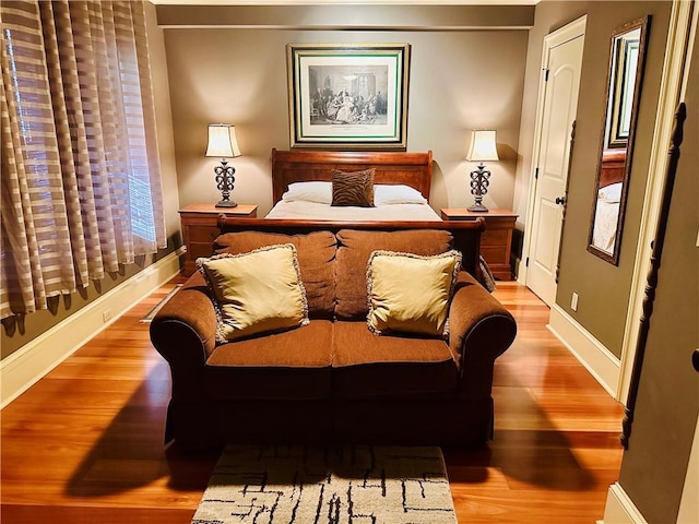 bedroom featuring light wood-style flooring and baseboards