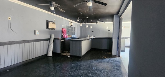 kitchen with ornamental molding, a wall unit AC, and ceiling fan