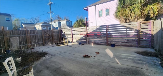 view of patio / terrace with a fenced backyard and a gate