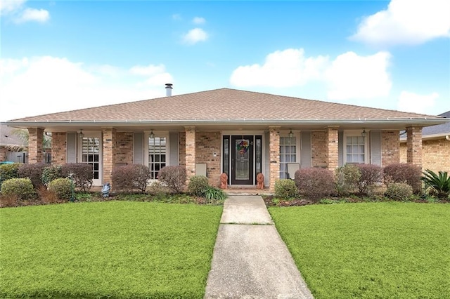641 Petit Berdot Dr, Kenner, LA 70065 - ranch-style house with a front lawn, brick siding, covered porch, and roof with shingles
