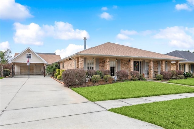 single story home with concrete driveway, brick siding, and a front lawn