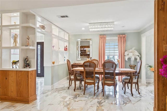 641 Petit Berdot Dr, Kenner, LA 70065 - dining area featuring crown molding, baseboards, and marble finish flooring