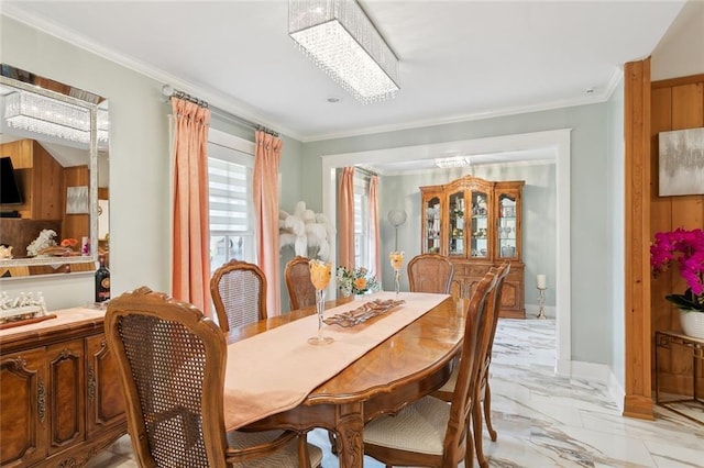 641 Petit Berdot Dr, Kenner, LA 70065 - dining room with crown molding, light marble finish floors, and baseboards
