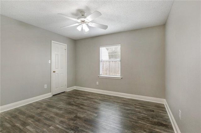 unfurnished room featuring a textured ceiling, a ceiling fan, dark wood-type flooring, and baseboards