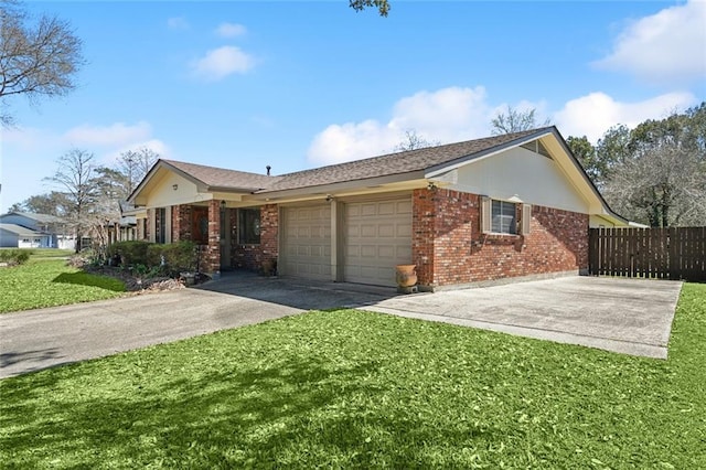 view of front of home with a garage, concrete driveway, fence, a front lawn, and brick siding