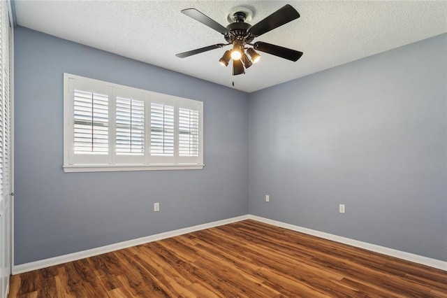 unfurnished room featuring a ceiling fan, a textured ceiling, baseboards, and wood finished floors