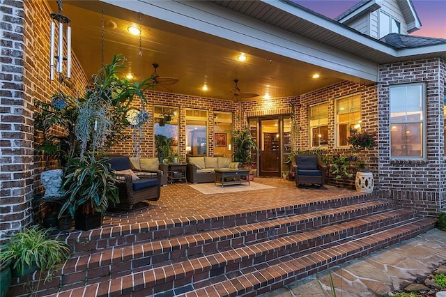 view of patio with ceiling fan and an outdoor living space