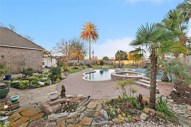 view of pool with a patio area and a fenced backyard