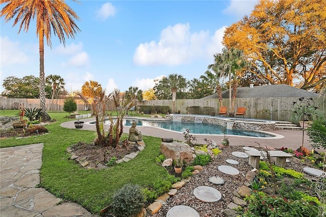 view of swimming pool featuring a fenced backyard, a fenced in pool, a lawn, and an in ground hot tub