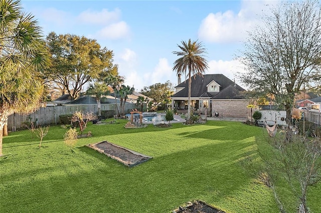 view of yard featuring a fenced backyard and a fenced in pool