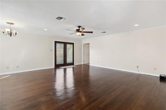 spare room with dark wood-style flooring, french doors, visible vents, ornamental molding, and baseboards