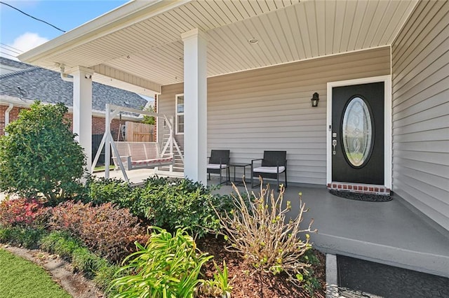 doorway to property featuring a porch