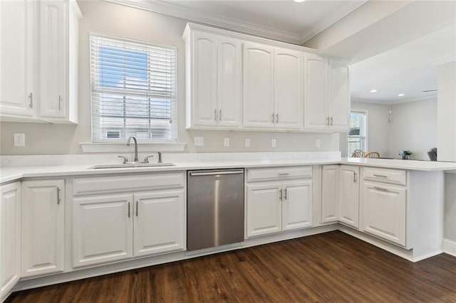 kitchen with dark wood-style flooring, crown molding, stainless steel dishwasher, white cabinetry, and a sink