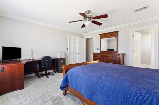 bedroom featuring carpet floors, a ceiling fan, visible vents, and crown molding