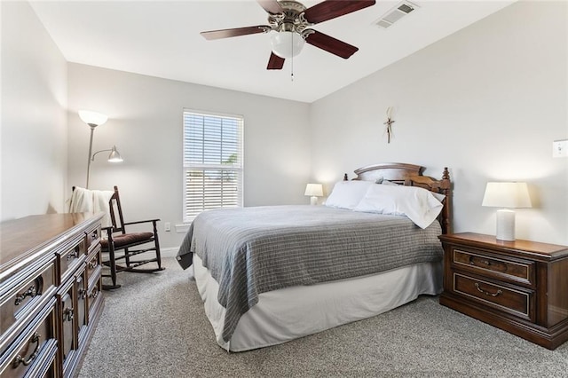 bedroom featuring baseboards, a ceiling fan, visible vents, and light colored carpet