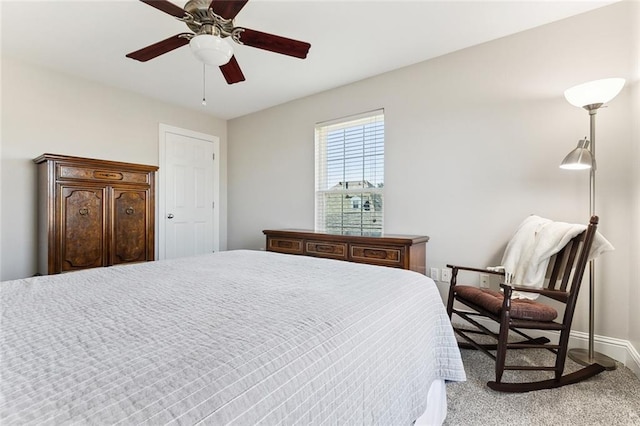 bedroom featuring ceiling fan and baseboards