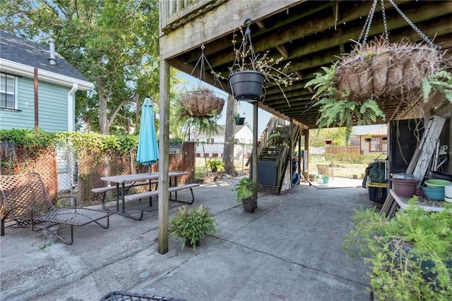 view of patio / terrace featuring fence and outdoor dining space