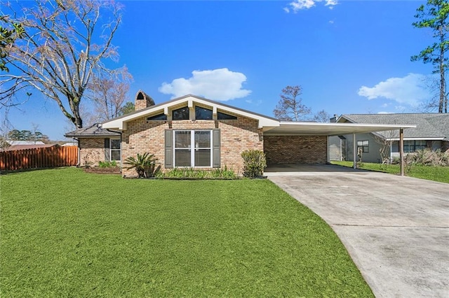 mid-century inspired home featuring concrete driveway, a chimney, fence, a front yard, and brick siding