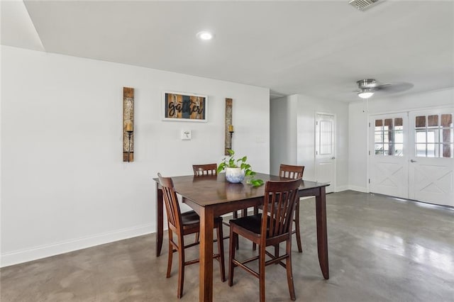 dining area with finished concrete flooring, recessed lighting, baseboards, and french doors