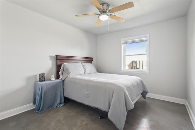 bedroom with ceiling fan and baseboards