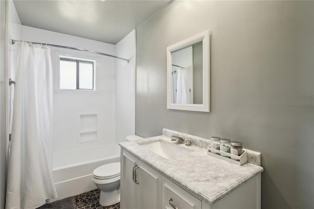 bathroom featuring shower / bath combo, vanity, and toilet