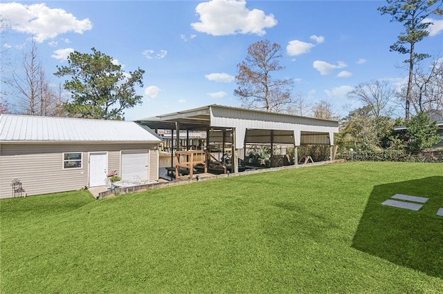 exterior space with an outbuilding, metal roof, and a lawn