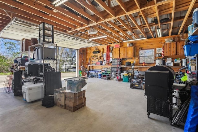 garage featuring a workshop area and a garage door opener